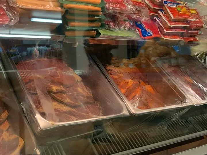 Trays of marinated steaks in the Flores Jr. meat case.